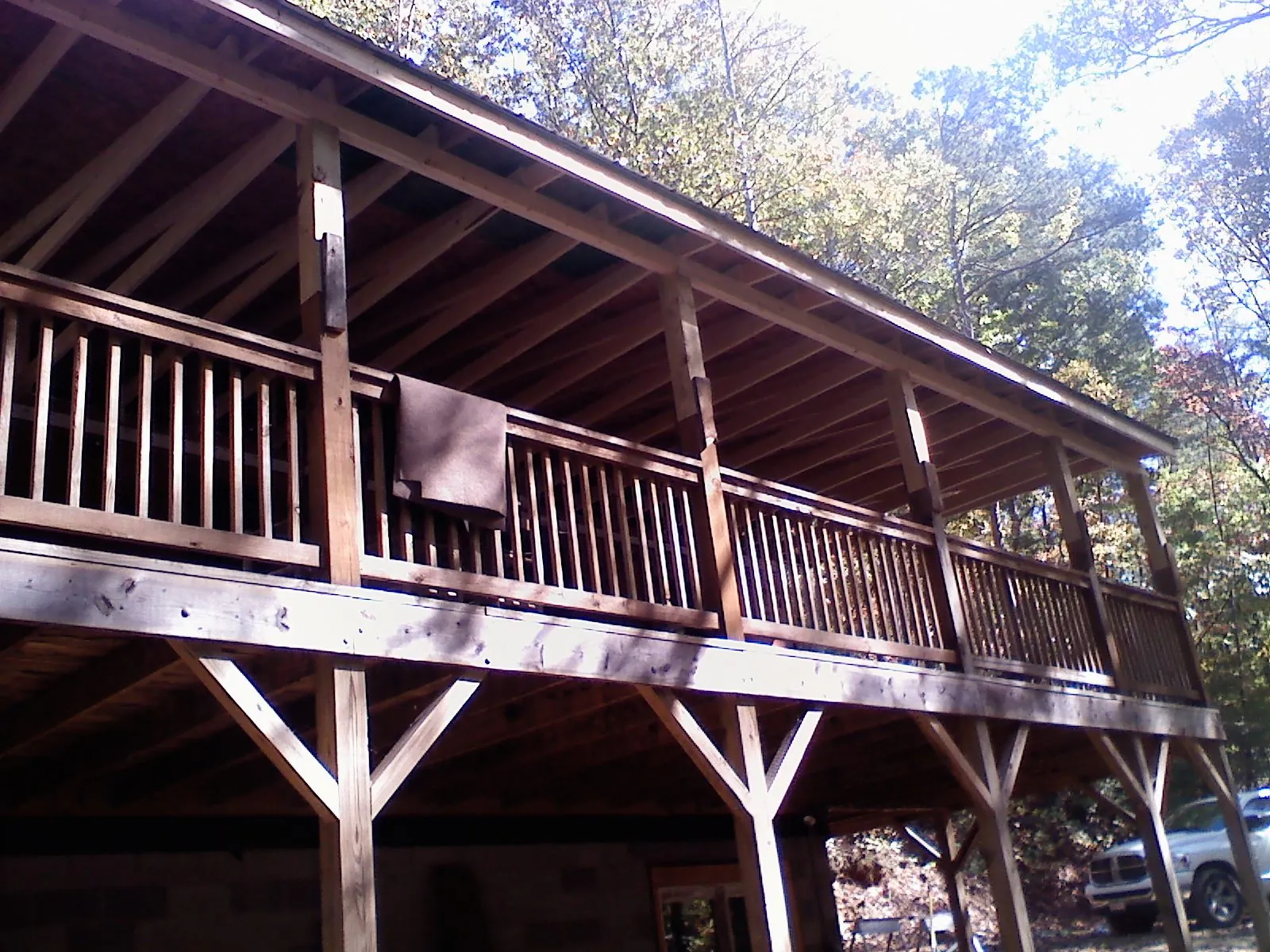 Timber framing under a new elevated porch and deck in Louisa